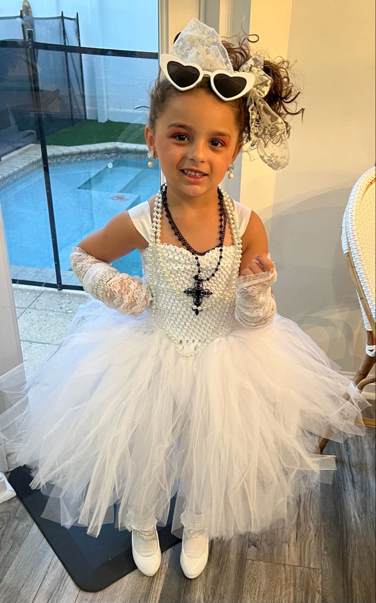 Kids/toddler/little girl DIY Madonna costume . 80’s theme party outfit . Like a virgin costume Madonna Party Theme, Madonna Like A Virgin Costume, Madonna Costume Diy, Like A Virgin Costume, Singers Costumes Ideas, Madonna Kids, Famous People Costumes, Madonna Birthday, Masquerade Party Outfit