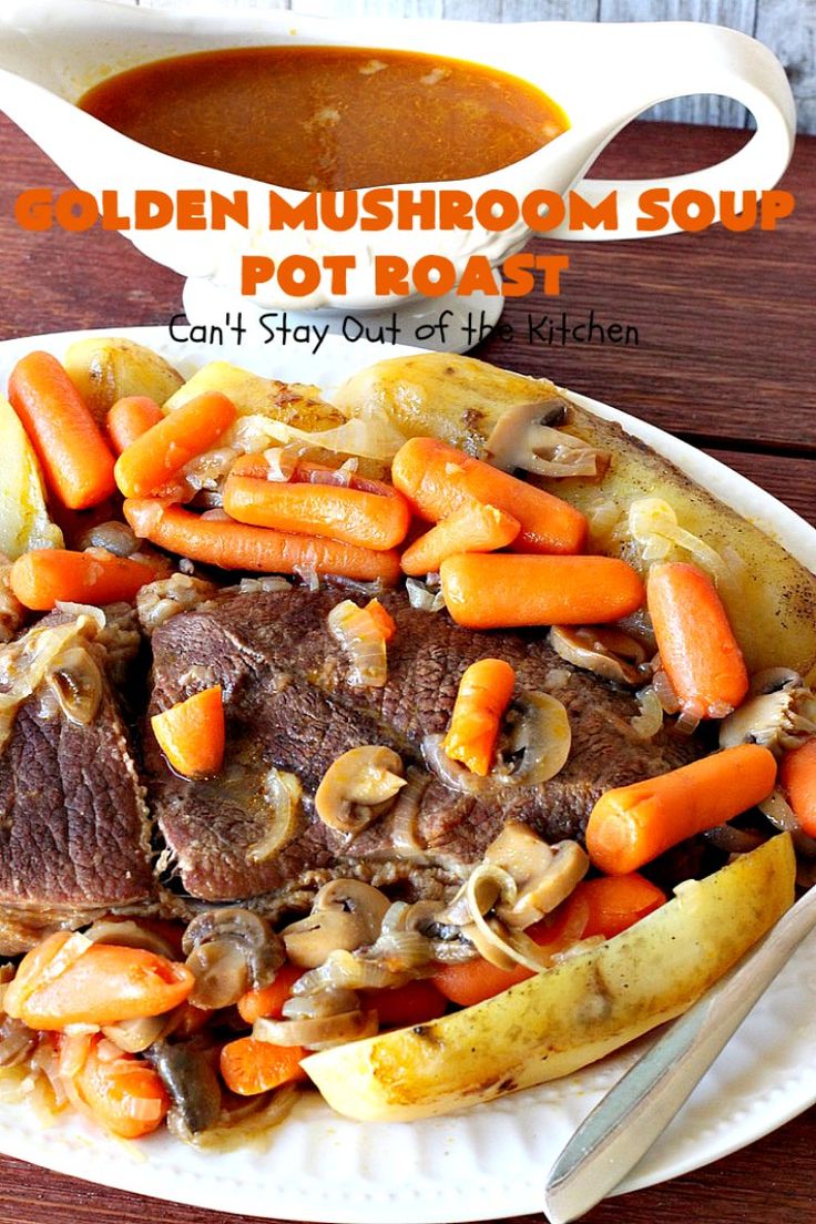 a white plate topped with roast, carrots and mushrooms