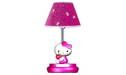 a hello kitty lamp with a pink shade