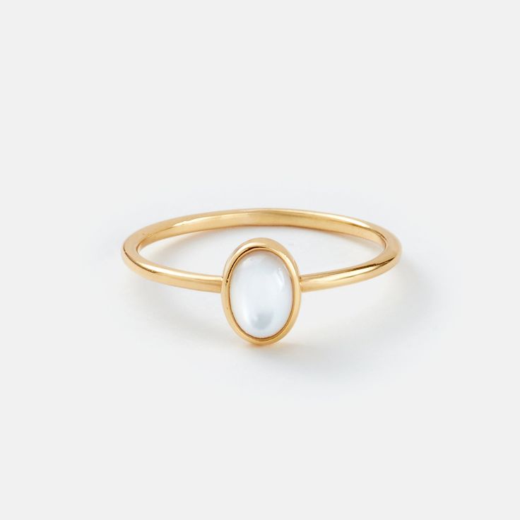 A small, delicate Gold Petite Oval Pearl Ring is a delightful, feminine choice. Crafted from eco-friendly recycled gold and a sustainable gemstone, it is the perfect accessory to pair with any Sara Patino Jewelry look. The soft and luminous white pearl offers a timeless beauty that is both classic and modern. Mother of Pearl is 6mm x 4mm Recycled 14k gold over sterling silver (vermeil) Elegant Oval Stackable Rings For Everyday, Elegant Stackable Rings For Everyday, Elegant Everyday Stackable Oval Rings, Gold Minimalist Oval Pearl Ring, Minimalist Gold Oval Pearl Ring, White Oval Pearl Ring In 14k Gold, Classic Opal Ring, Elegant Everyday Open Moonstone Ring, Minimalist Oval Moonstone Ring For Everyday