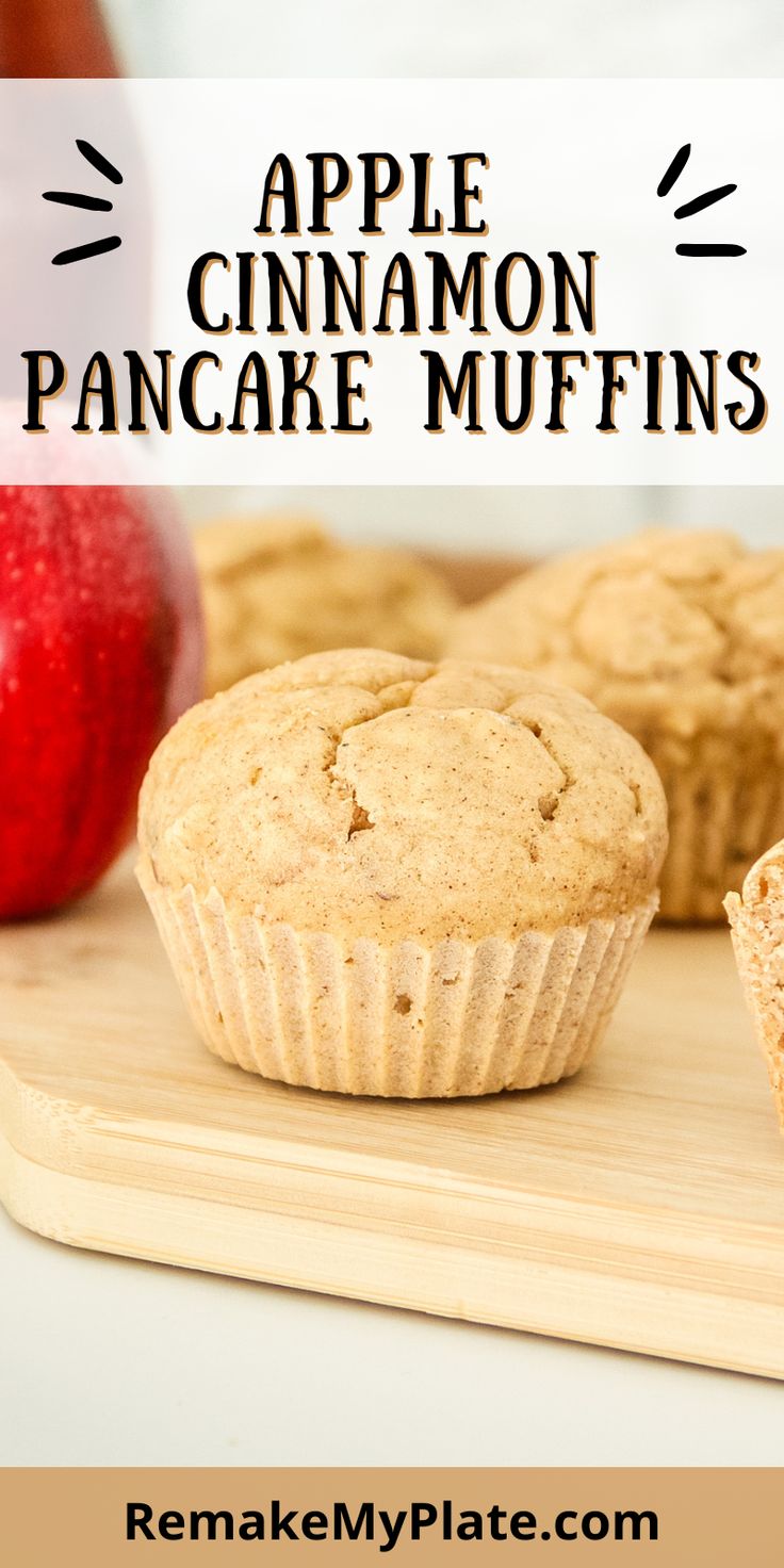 apple cinnamon pancake muffins on a cutting board with an apple in the background