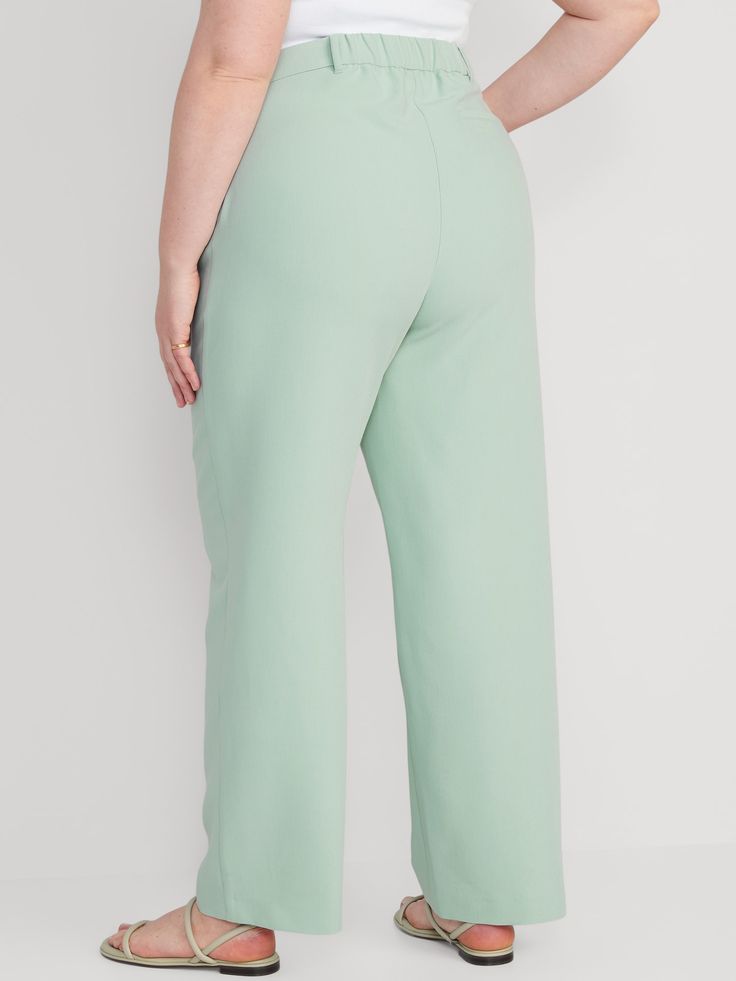 Partially-elasticized extra high-rise waistband, with built-in belt loops.  Concealed double hook-and-bar closure, built-in belt loops, hidden zip fly, and interior stay button.  On-seam diagonal side pockets, with back welt pocket.  Secret-smooth po Green Wide Leg Pants For Business Casual, Green Wide Leg Casual Pants For Business Casual, Green Solid Color Bottoms For Work, Green Solid Color Bottoms For Workwear, Casual Pants With Elastic Waistband For Office, Wide Leg Bottoms With Pockets For Office, Wide Leg Office Bottoms With Pockets, Office Wide-leg Bottoms With Pockets, Office Wide Leg Bottoms With Pockets