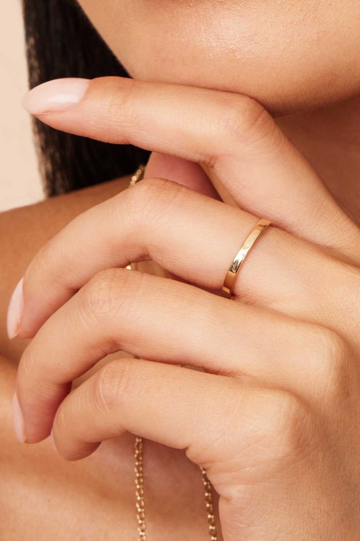 Whether you're looking for a classic band or saying "I do," our Forever Band Ring is the way to go. The polished solid gold band offers impressive shine, while the comfort fit design makes it an easy choice for daily wear. Slip on this timeless piece with any look to add instant elegance. Metal: 14k Solid Yellow Gold Dimensions: 3mm Width, Comfort Fit Available in Multiple Sizes Weight: 1.2 to 1.6 grams depending on size selected Construction: Tubing Origin: Crafted in Arezzo, Italy Minimalist Thick Band Diamond Cut Jewelry, Timeless Yellow Gold Bands As Gift, Anniversary Bands In Polished Yellow Gold, Anniversary Yellow Gold Bands With Polished Finish, Anniversary Yellow Gold Polished Bands, Classic Open Band Diamond Cut Jewelry, Yellow Gold Thick Band Wedding Ring Fine Jewelry, Timeless Bands With Smooth Bezel For Anniversary, Classic Jewelry With Polished Finish And Wide Band