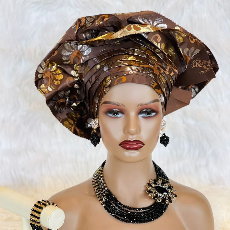 Get ready to make a statement with the African Traditional Hat Gele, a must-have accessory for any fashion-forward individual. Handmade with care, this pre-tied and ready-to-wear hat is available in multiple colors to match any outfit.  Whether you're attending a wedding, as the bride, bridesmaid, mother of the bride, or simply as a guest, this hat will add an extra touch of elegance and style to your look.  So why wait? Add some African flair to your wardrobe today with the African Traditional Hat Gele! Wax Photos, Faux Fur Handbag, Fur Handbags, Feather Fan, Handmade African, African Wedding, Livingston, African Fabric, Head Covering