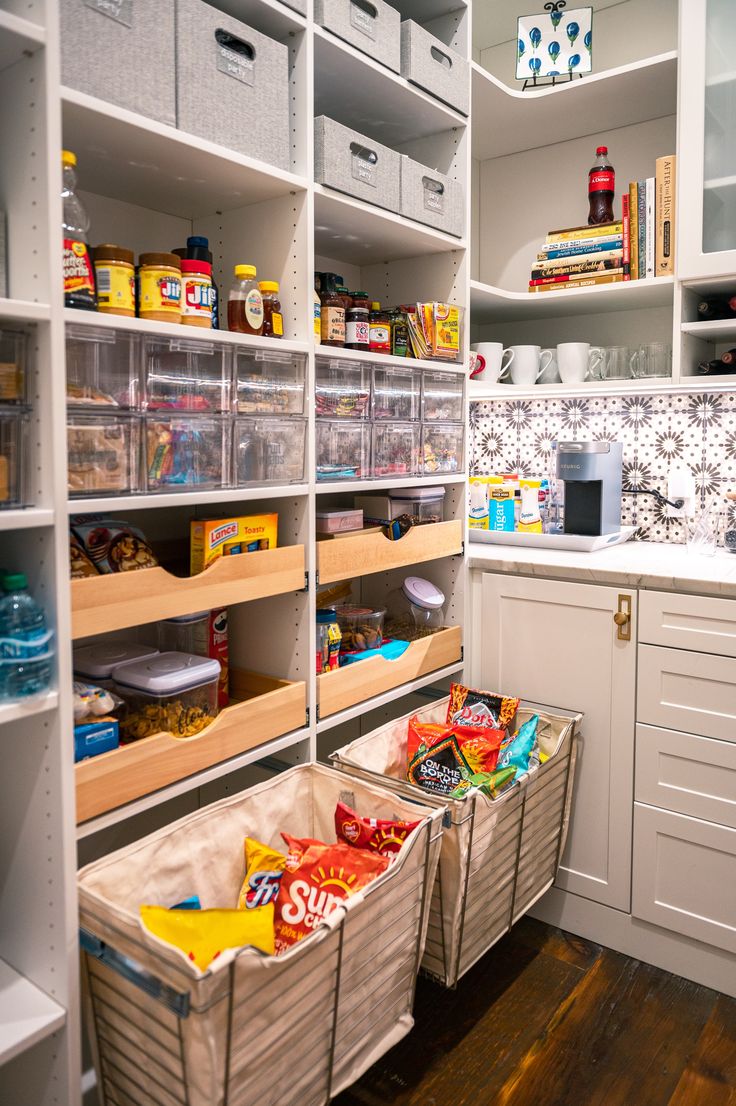 an organized pantry with bins and baskets