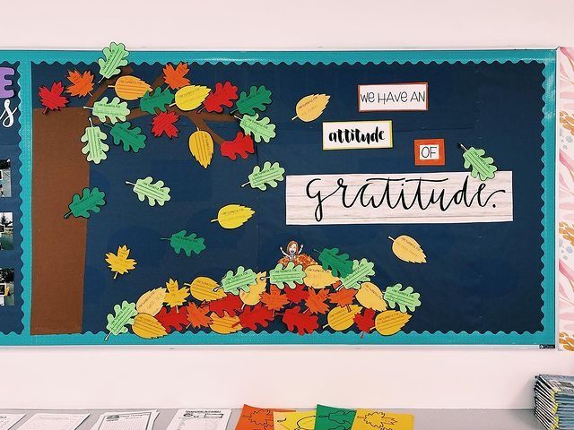 a bulletin board with fall leaves on it