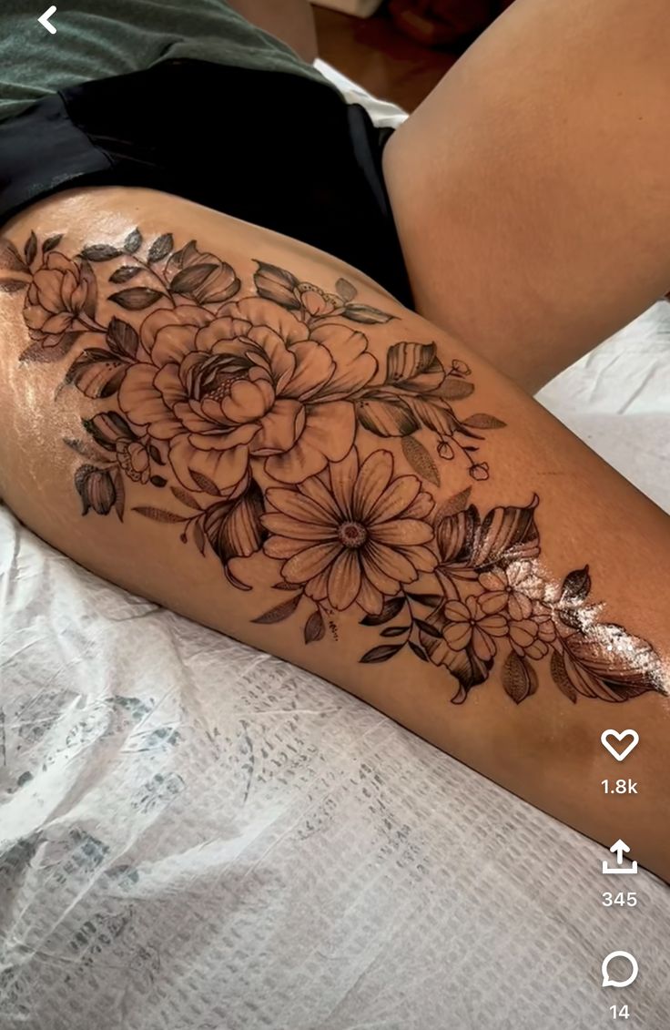 a woman's leg with flowers on it