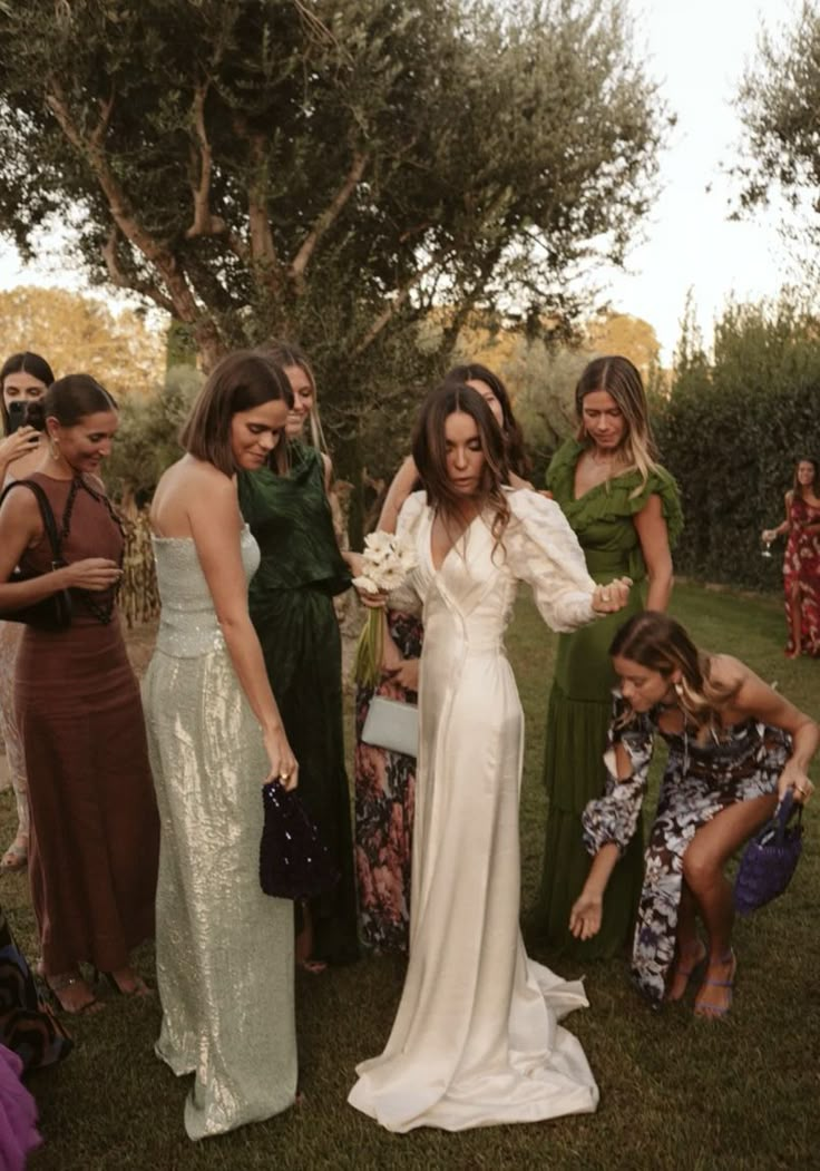 a group of women standing around each other