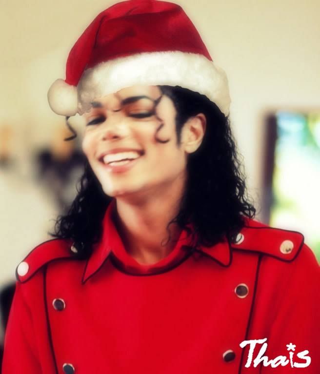 a man in a red shirt wearing a santa hat