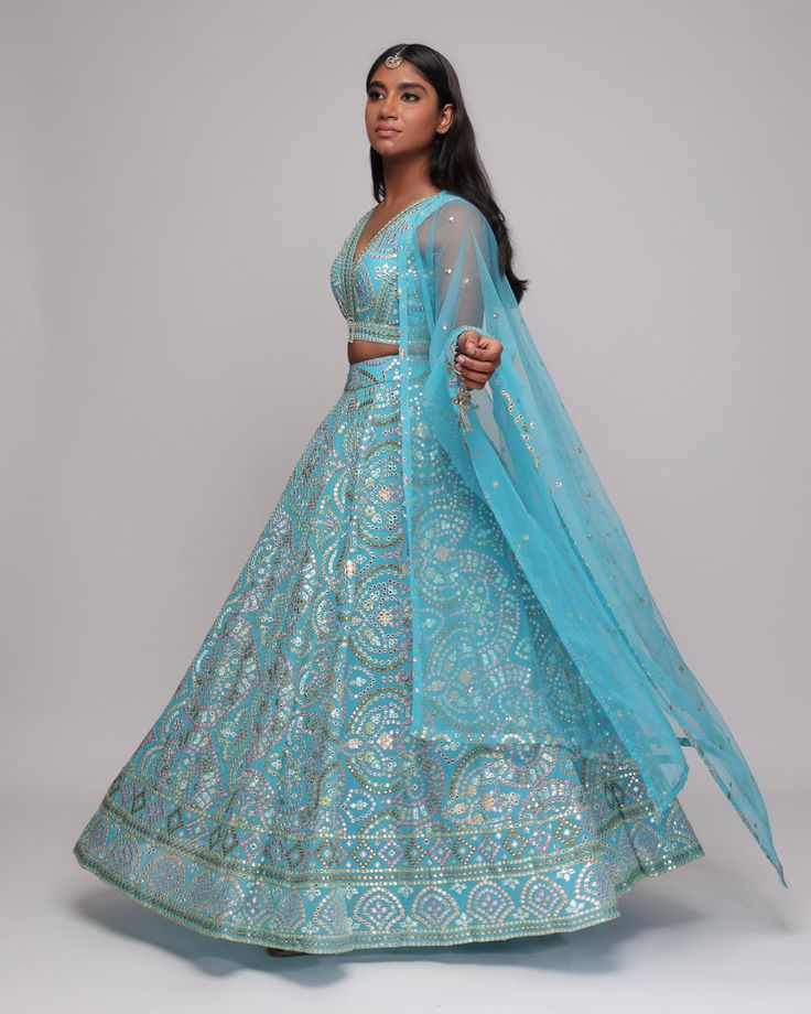 Manisha Lengha Traditional Light Blue Sharara For Reception, Festive Light Blue Sharara For Reception, Fitted Light Blue Anarkali Set With Zari Work, Light Blue Sharara With Dupatta For Reception, Traditional Light Blue Zari Work Dresses, Festive Light Blue Embroidered Choli, Light Blue Zari Work Anarkali Set For Reception, Light Blue Floor-length Anarkali Set For Festive Occasions, Festive Light Blue Sharara With Sheer Dupatta