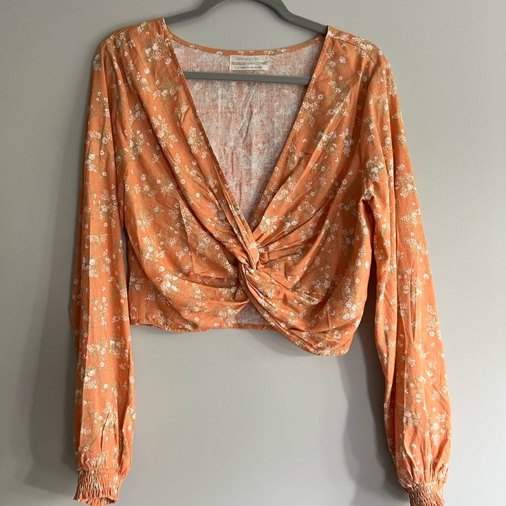 Urban Outfitters Long Sleeve Crop Top Never Worn Before Just Took Tags Off When Trying On Super Cute And Perfect For Spring/Summer Orange Floral Top Urban Outfitters V-neck Summer Blouse, Urban Outfitters Spring Vacation Blouse, Urban Outfitters Blouse For Spring Vacation, Urban Outfitters Blouse For Vacation In Spring, Urban Outfitters Long Sleeve Tops With Floral Print, Urban Outfitters V-neck Spring Blouse, Urban Outfitters V-neck Blouse For Spring, Urban Outfitters Summer V-neck Blouse, Urban Outfitters Summer Beach Blouse