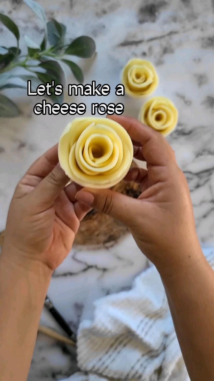 someone is holding some food in their hand and it says, let's make a cheese rose