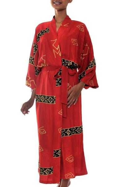 Bold bands of black and beige make a captivating combination with crimson. Revealing traditional motifs they show the tonal variations of batik. Nyoman Nadri fashions this dramatic robe from featuring a front-wrap style wide sleeves and matching belt. This handpainted batik robe is a truly original work of art. Sunlight water dye and temperature all factor into the look of the finished robe. This should be considered a unique design made especially for you. Colors and pattern placement will vary Dramatic Robe, Vintage Home Ideas, Women Robe, Robe Women, Sunset Red, Traditional Kimono, Batik Pattern, Modern Vintage Home, Traditional Motifs