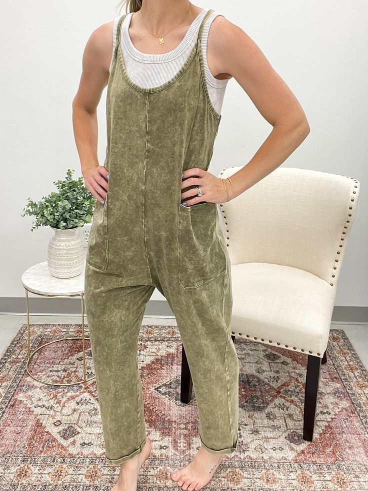 Get ready to elevate your look with our One Shot Stone Washed Jumpsuit. This harem jumpsuit features a relaxed, oversized fit for ultimate comfort, while the pockets add functionality. Perfect for a casual day out or dressing up for a night out, this jumpsuit is a versatile and stylish addition to your wardrobe. Features zipper pocket detail on back Runs true to size Model is 5’4 and wearing a small/medium Cotton Overall Jumpsuits And Rompers For Leisure, Oversized Jumpsuits And Rompers With Pockets For Loungewear, Relaxed Fit Cotton Jumpsuits And Rompers For Leisure, Summer Leisure Relaxed Fit Jumpsuits And Rompers, Relaxed Fit Cotton Jumpsuits For Leisure, Summer Leisure Jumpsuits And Rompers With Relaxed Fit, Comfortable Cotton Solid Color Jumpsuits And Rompers, Comfortable Solid Cotton Jumpsuits And Rompers, Cotton Jumpsuits And Rompers For Leisure