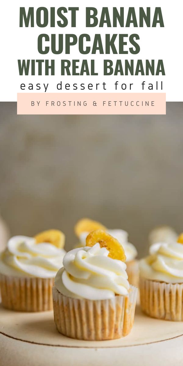 three cupcakes with white frosting and orange slices on top are sitting on a plate