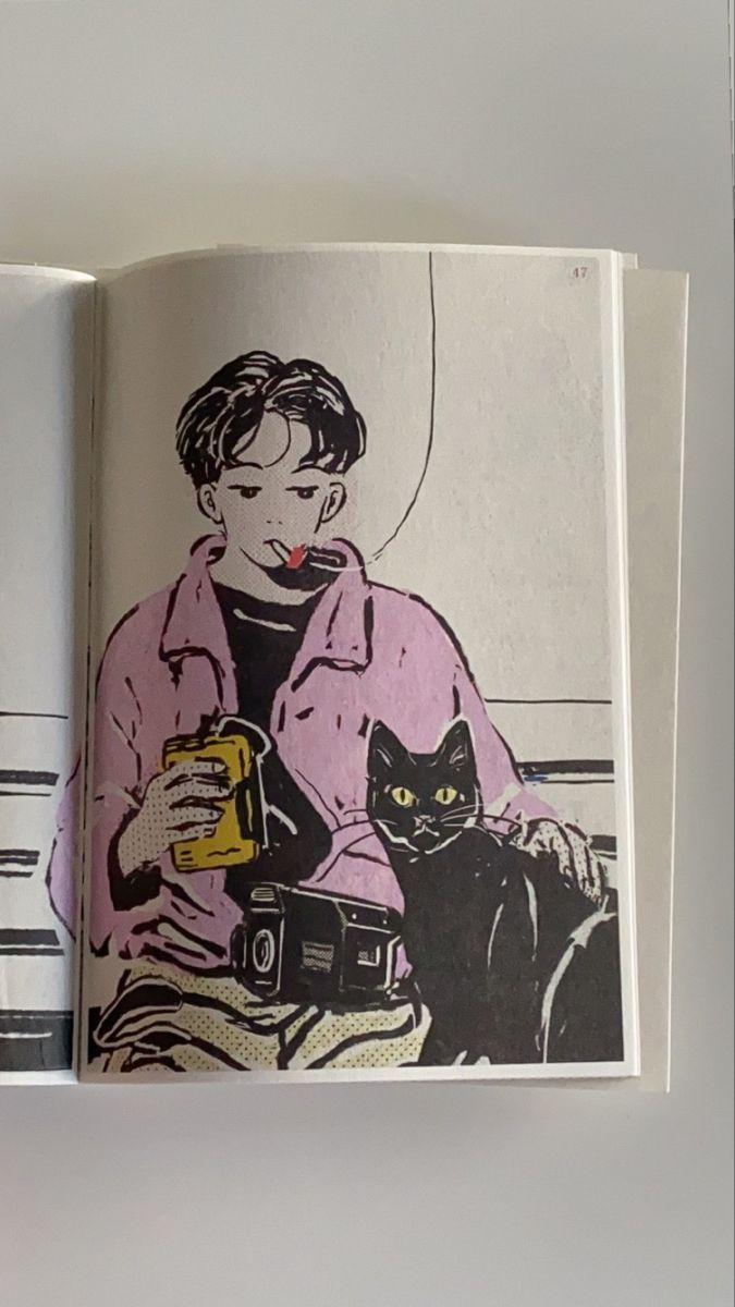 an open book with a drawing of a person and a cat