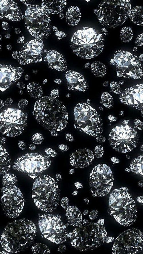 many diamonds are arranged in rows on a black background