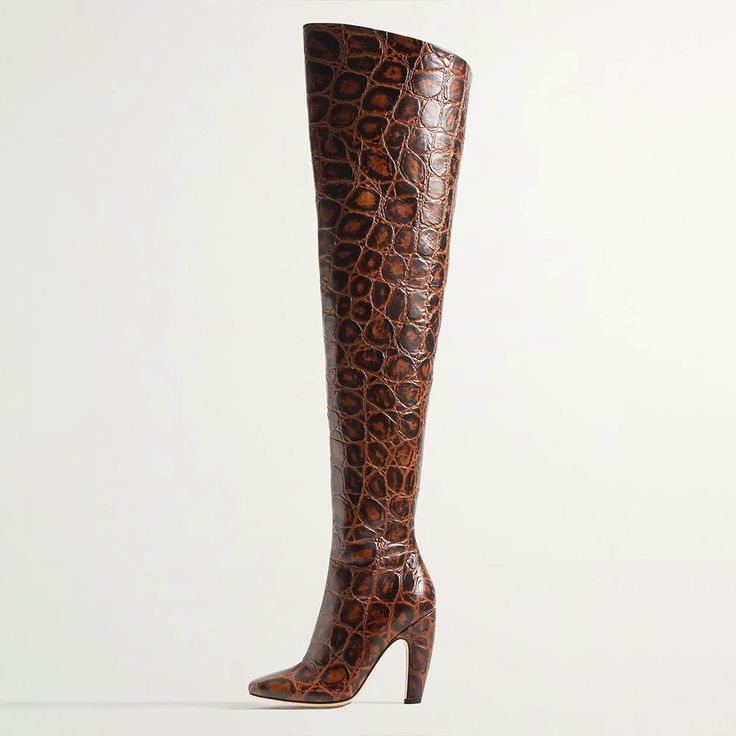 Elevate your style with these luxurious brown crocodile-embossed thigh-high boots featuring a chic square toe and high heel. A statement piece that exudes sophistication and fashion-forward flair. Color: Brown Heel Type: Curved heel Heel Height: 4.53'' / 115 mm approx Product measurements were taken using size 8. Please note that measurements may vary by size. Toe: Square toe Crocodile embossed design Side-zipped design Handcrafted US sizing. Fits true to size. Leather Over The Knee Boots, Crocs Boots, Bottega Veneta Shoes, Orange Mini Dress, Leather Knee Boots, Brown Square, Shoes Boots Ankle, Brown Heels, Brown Shoe