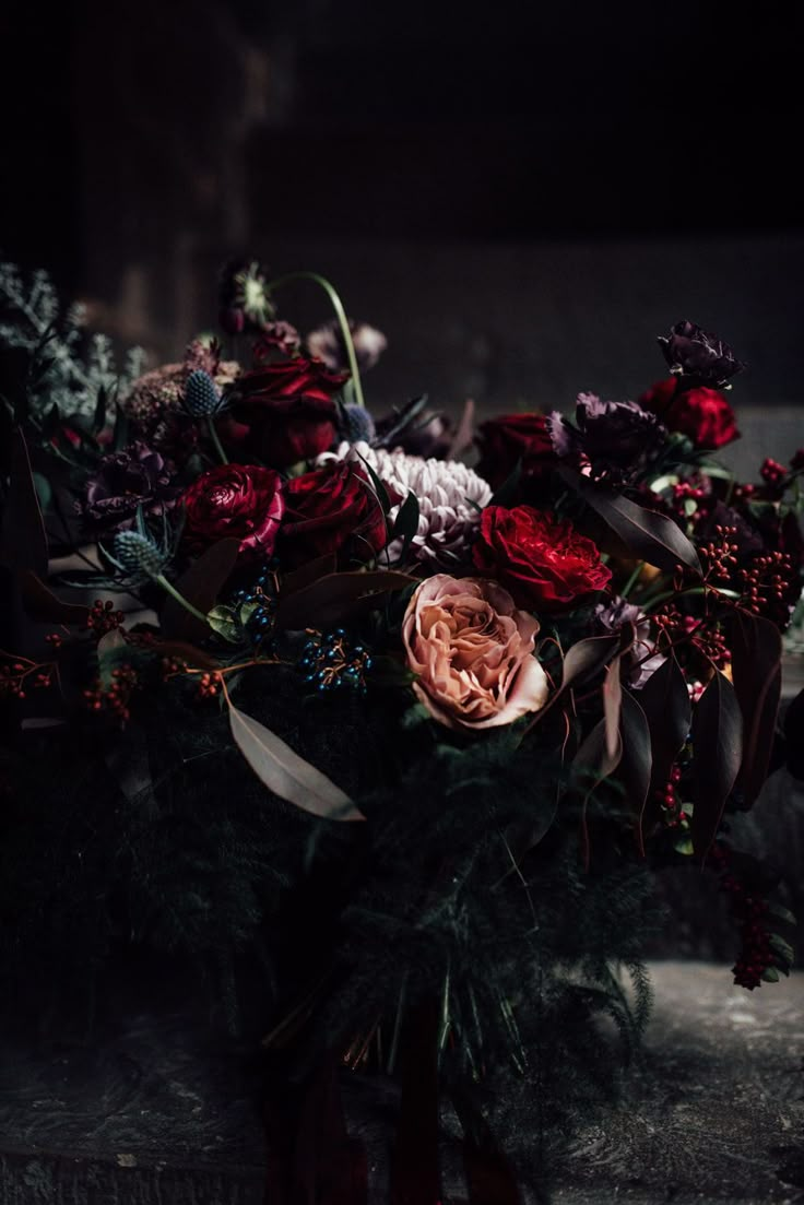 a bouquet of flowers sitting on top of a table