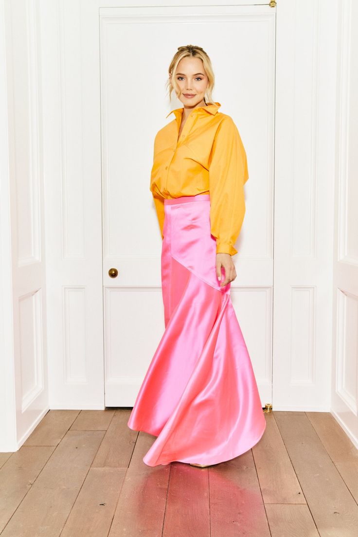 The perfect hue of neon pink that will make any outfit stand out. This pink silk skirt with side zip is a stunner in every way. MADE IN THE USA DRY CLEAN ONLY Pink Satin Skirt For Spring, Pink Satin Flared Skirt, Pink Silk Evening Skirt, Chic Pink Skirt For Cocktail, Spring Pink Silk Maxi Skirt, Pink Silk Maxi Skirt For Spring, Pink Satin Skirt For Party, Pink Satin Party Skirt, Pink Evening Skirt