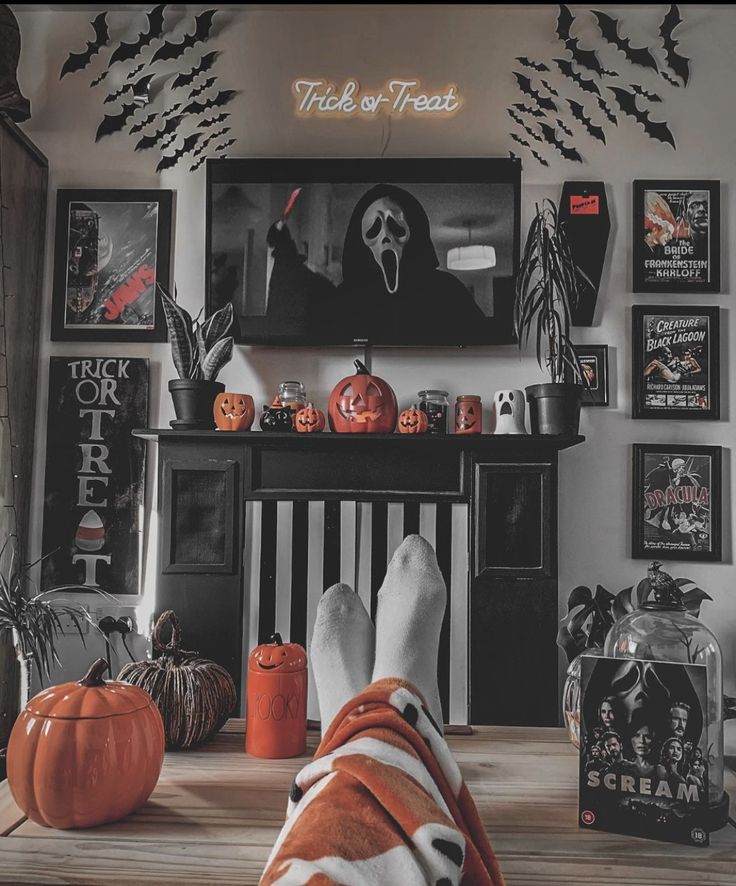 a person's feet in front of a fireplace decorated for halloween