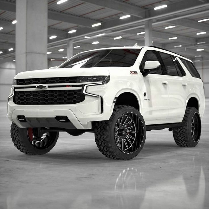 a white truck is parked in a parking garage