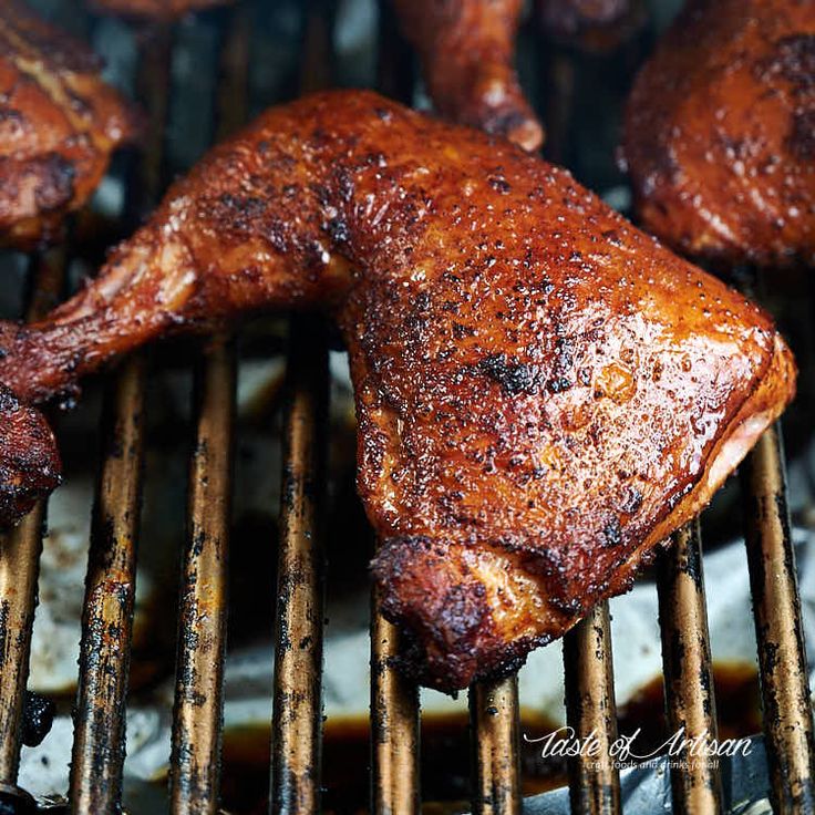 some meat is being cooked on a grill