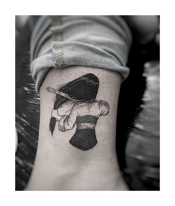 a woman with a hat on her head is shown in black and white tattoo art