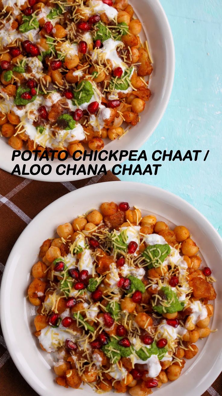 two white bowls filled with food on top of a table