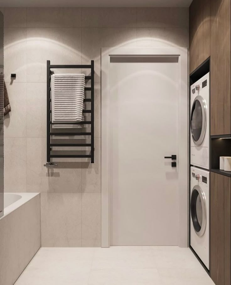 a washer and dryer in a modern bathroom