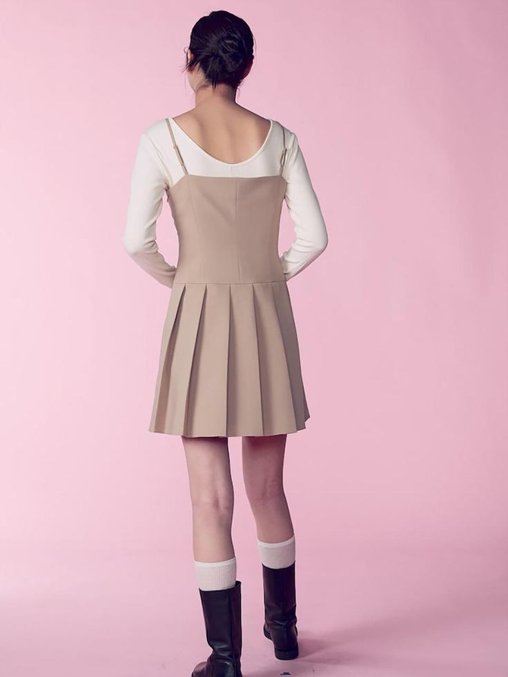 This is a sleeveless mini dress with an attractive minimalist vibe. The light length and cut lines on the body create a slim body line, and the pleated details on the skirt add a casual yet feminine mood.- You can adjust the length of the shoulder straps to fit your body shape.- Open and close with side zipper- Can be worn alone or layered with innerwear such as a T-shirt*The color of the product may differ from the actual color depending on the monitor resolution. Beige Knee-length Feminine Mini Dress, Beige Pleated Sleeveless Mini Dress, Beige Sleeveless Pleated Mini Dress, Beige Pleated Skirt Dress, Chic Beige Pleated Hem Dress, Chic Beige Dress With Pleated Hem, Chic Beige Knee-length Mini Dress, Feminine Pleated Knee-length Mini Dress, Pleated Sleeveless Mini Dress For Spring