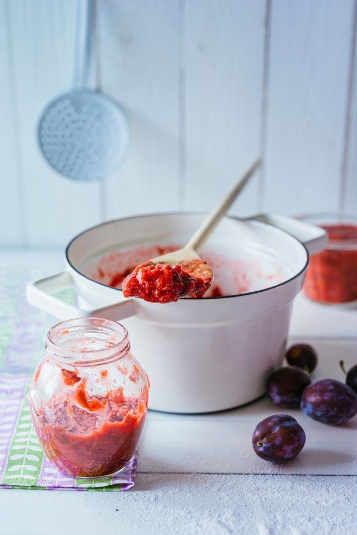 an image of a bowl of food with cherries and yogurt in it