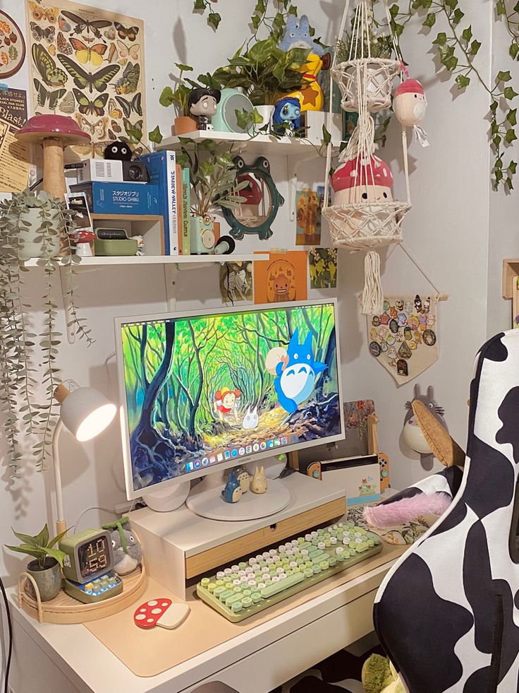 a computer desk topped with a desktop computer next to a chair and plant wallpaper