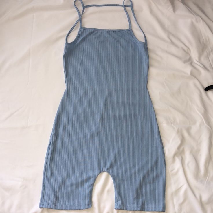 Jumpsuit Romper Pretty Blue Color Size Medium Never Worn Open Back Blue Cotton Bodysuit For Loungewear, Casual Blue Cotton Bodysuit, Blue Summer Jumpsuits And Rompers For Loungewear, Blue Stretch Cotton Bodysuit, Summer Loungewear Overall Bodysuit, Casual Light Blue Sleeveless Bodysuit, Blue Cotton Bodysuit For The Beach, Blue Cotton Beach Bodysuit, Blue Sleeveless Cotton Bodysuit