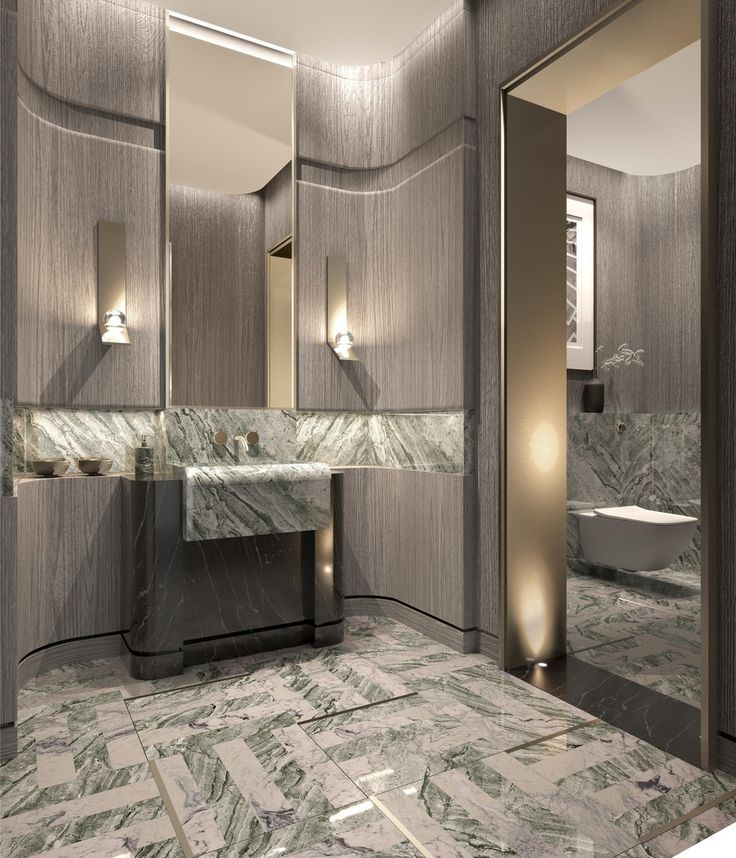 a bathroom with marble floors and walls