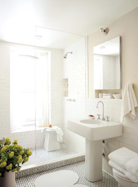 a bathroom with a sink, mirror and toilet