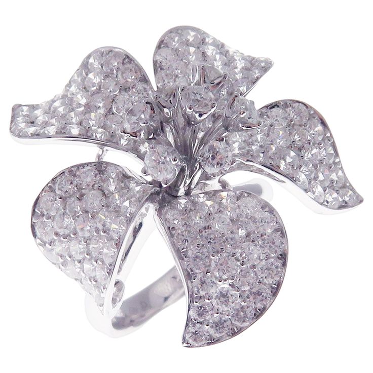 This pave diamond medium flower ring is crafted in 18-karat white gold, featuring 157 round white diamonds totaling of 4.58 carats. Approximate total weight 10.14 grams. Standard Ring size 7 SI-G Quality natural white diamonds. American Diamond, Gems Jewelry, Flower Ring, White Diamonds, Cocktail Rings, Pave Diamonds, Diamond White, Jewelry Rings, Ring Size