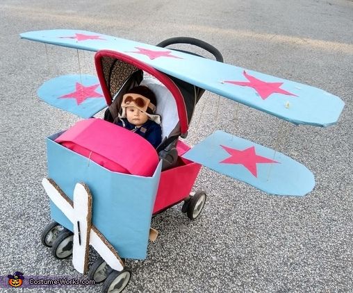 a toy airplane with a doll in it