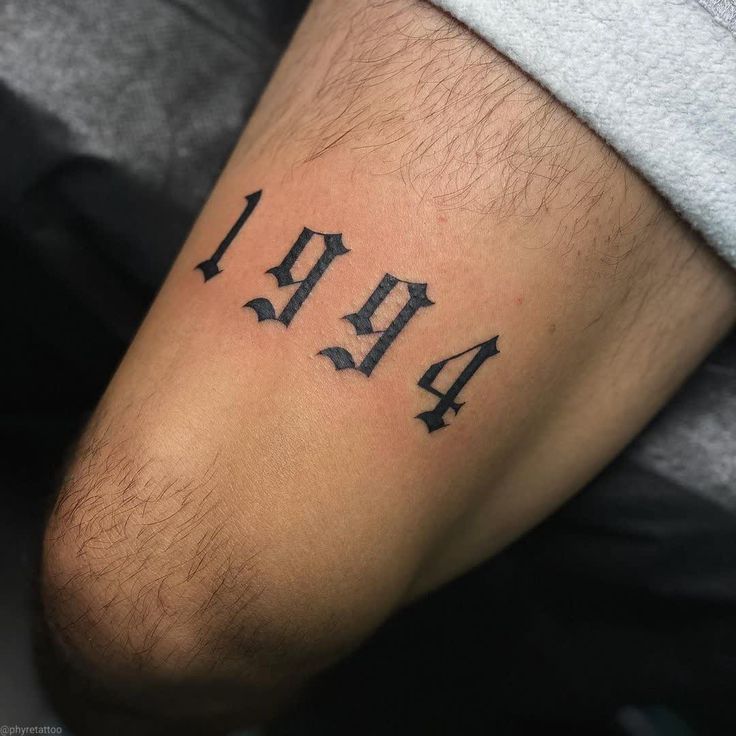 a man's arm with the number forty on it