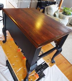 a wooden desk sitting on top of a hard wood floor