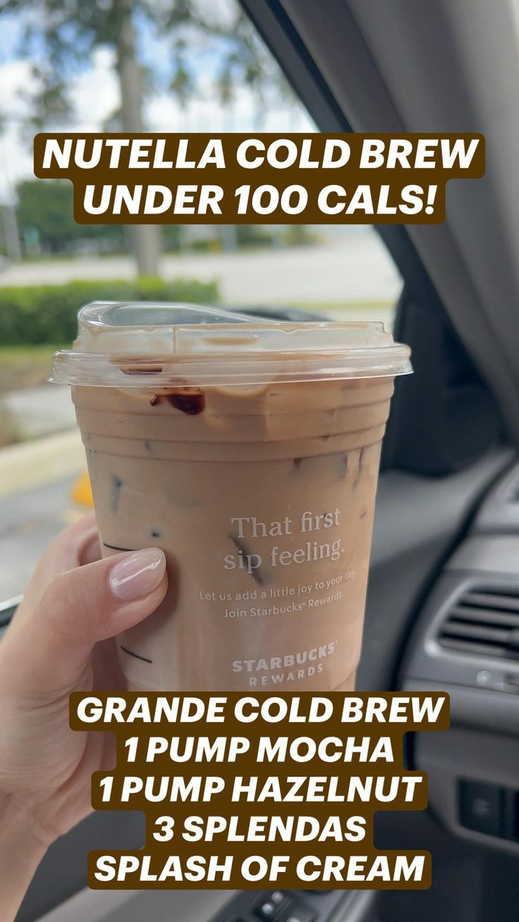 a person holding up a cup of coffee in their hand with the words nutella cold brew under 10 cals