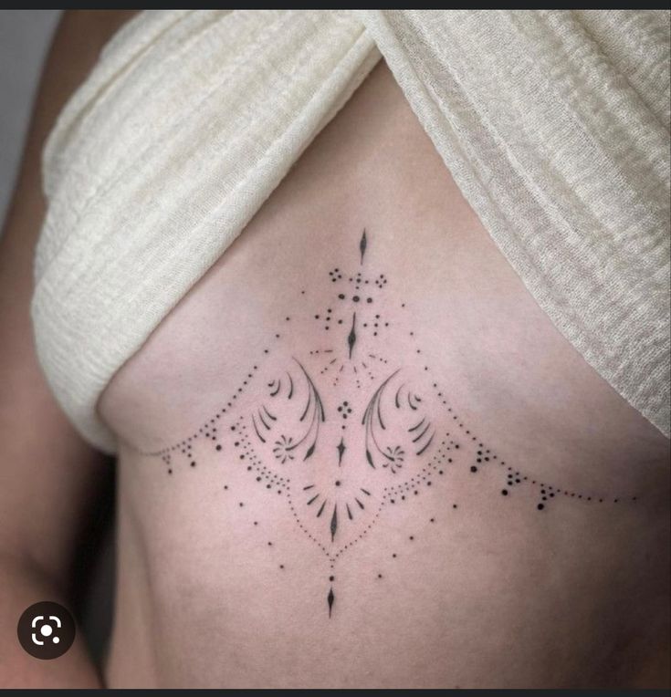 a woman's stomach with an intricate design on it