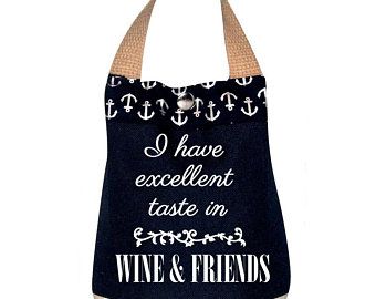 a wine and friends tote bag with an anchor on the front that says i have excellent taste in wine and friends