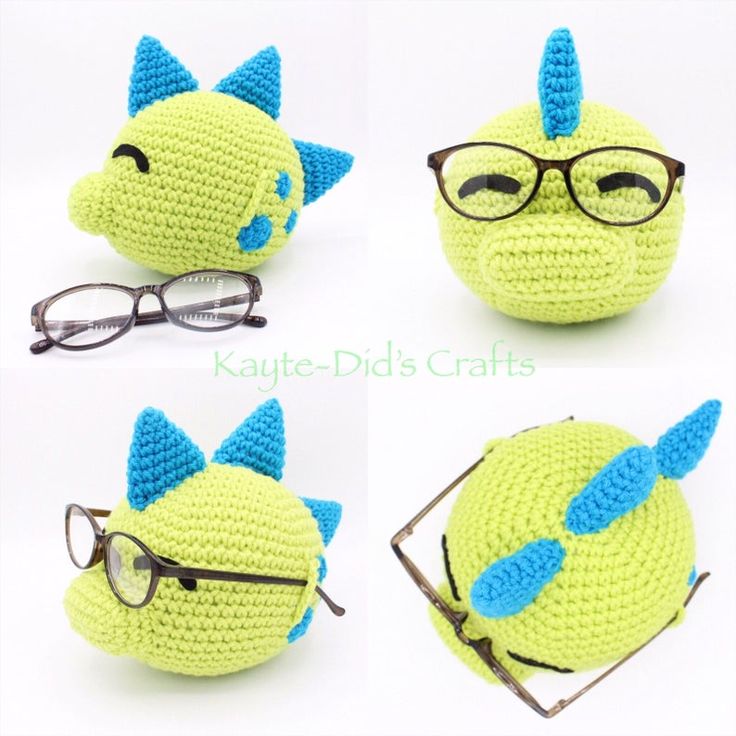 crocheted toy with glasses on it's head and eyeglasses in the shape of a dragon