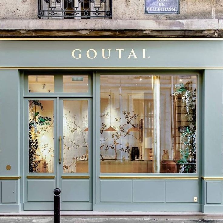 the entrance to a store with glass doors and windows that say goutal on it