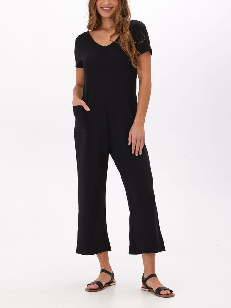 Introducing our Rainey Modal Terry Short Sleeve Jumpsuit, a revamped version of our best-selling Rainey Jumpsuit. With added sleeves and a new fall-inspired design, stay comfortable and stylish in this versatile piece. Perfect for any occasion, this jumpsuit will surely become your go-to outfit! Versatile Black Stretch Jumpsuits And Rompers, Black Relaxed Fit Jumpsuits And Rompers For Loungewear, Versatile Black V-neck Jumpsuits And Rompers, Black Relaxed Fit Jumpsuits And Rompers, Black Relaxed Fit Overalls And Jumpsuits, Fitted Black Jumpsuit For Lounging, Black Lounging Jumpsuits And Rompers For Spring, Black Stretch Jumpsuits And Rompers With Pockets, Black Stretch Jumpsuit With Pockets