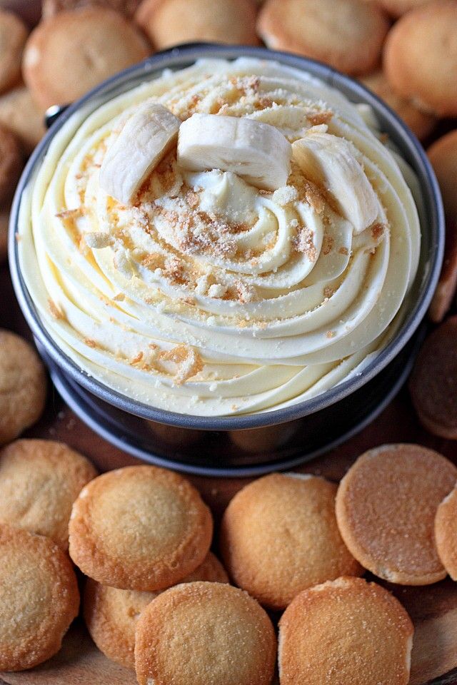 a platter filled with cookies and whipped cream