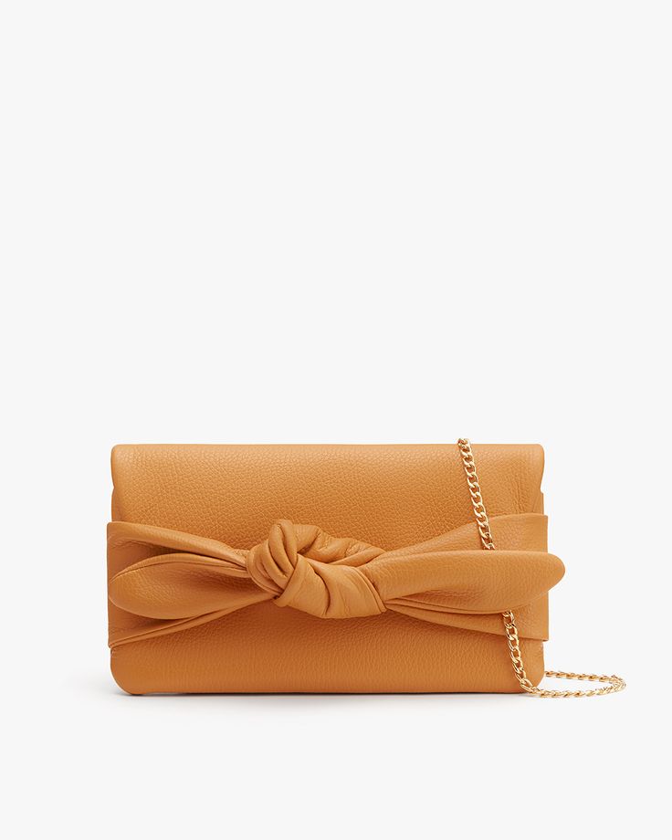 Bow Clutch | Cuyana Bow Purse, Bow Clutch, Statement Clutch, Waste Collection, Mini Bow, Leather Industry, Bow Bag, Mini Bows, Small Leather Goods