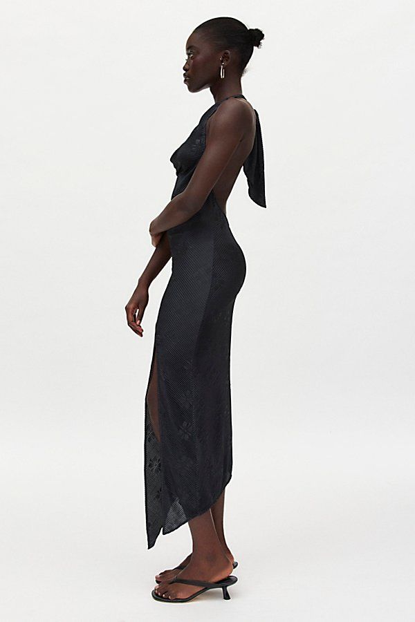 Slinky Silence + Noise midi dress in a textured plisse fabric. Designed in a body-skimming silhouette featuring a plunging cowl neck, halter straps and a spliced asymmetric hem. Finished with a high leg slit for added dimension. Only at Urban Outfitters. Features Silence + Noise Sienna plisse cowl neck halter midi dress Asymmetric hanky hem midi dress Soft & stretchy printed plisse fabric Plunging cowl neckline with halter straps Draping down the bodice Open back Spliced seam skirt with leg slit Plisse Fabric, Hanky Hem, Halter Midi Dress, Cowl Neckline, High Leg, Staple Pieces, Black Fits, Asymmetric Hem, Cowl Neck