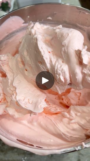 a bowl filled with whipped cream sitting on top of a table